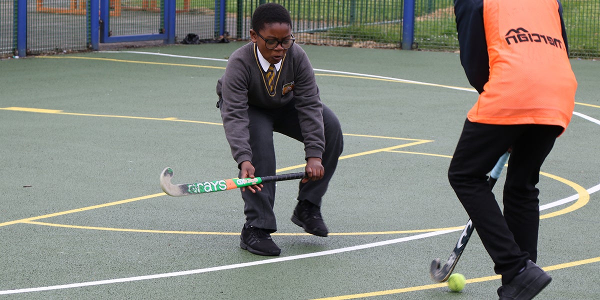 School Children playing hockey at Pollards Hill Youth Centre