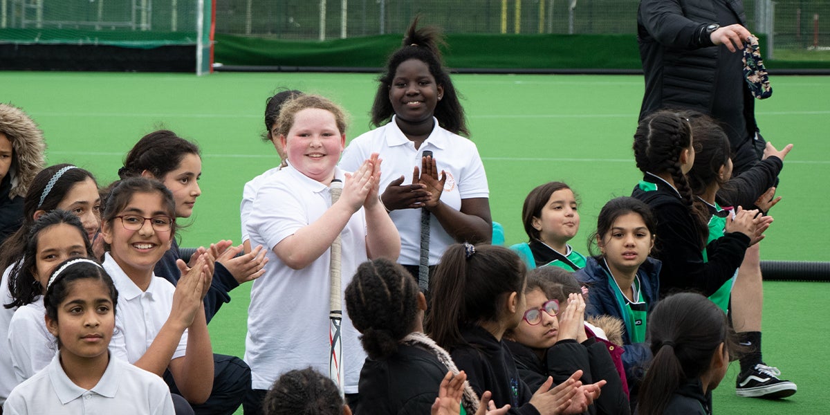 Young Girls smiling at hockey tournament in Slough 
