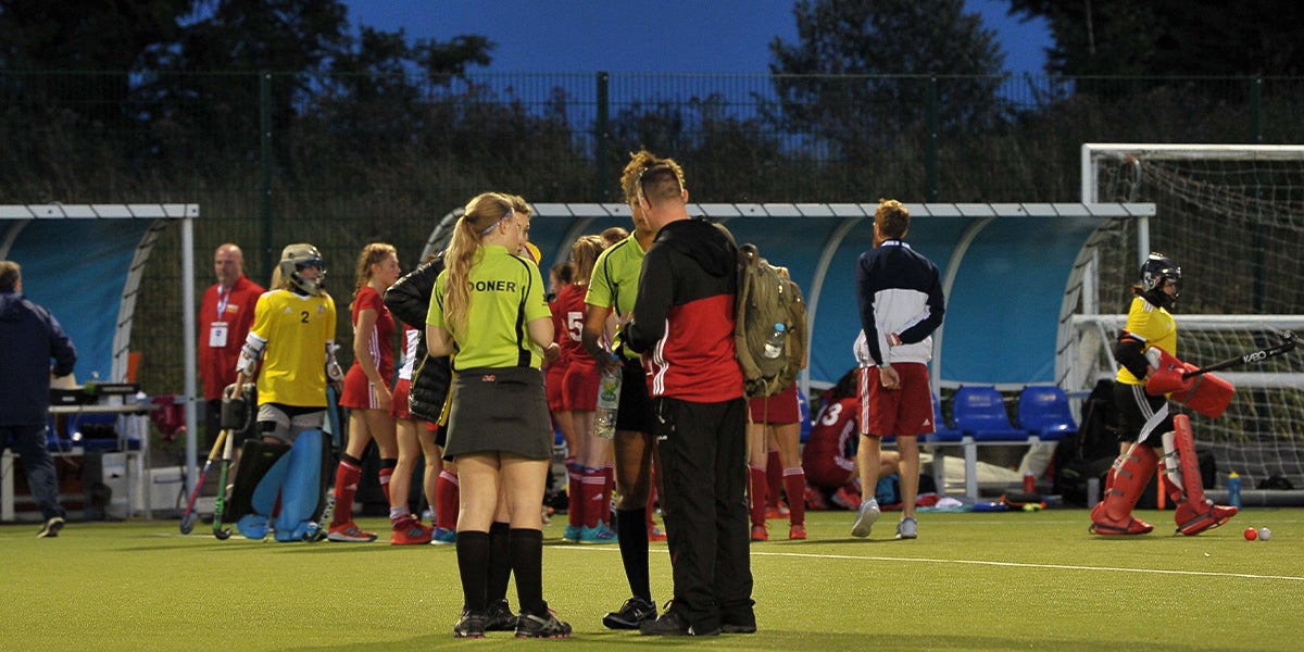 umpires talking on the pitch 