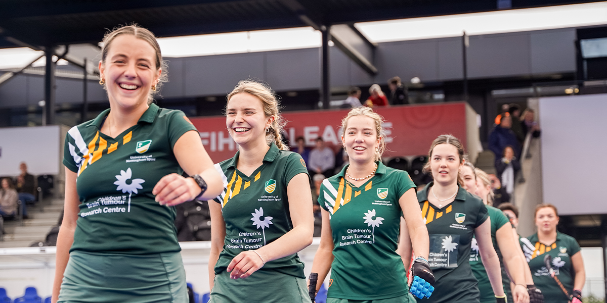 Nottingham Uni Female Hockey Players smiling in the line-up