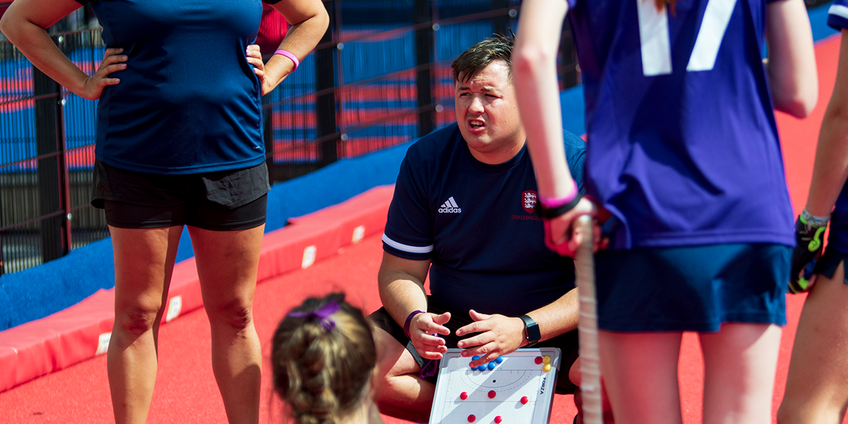 Coach talking to players 